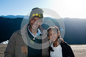 African American boy and girl on vacation in the mountains