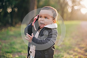 African American Boy playing with Mobile Phone