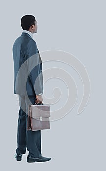 African American business man from the back looking at something isolated white background.