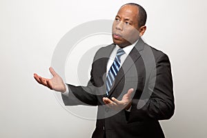 African American Business Man With Both Hands Signaling a Request for Explanation