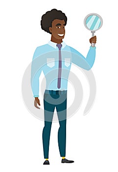 African-american business man holding hand mirror.