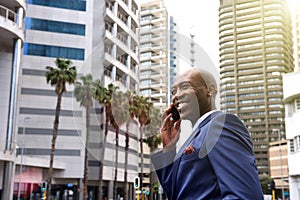 African american business man talking on mobile phone in the city