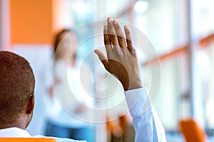 African american Business people Raising there Hand Up at a Conference to answer a question