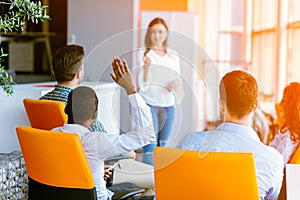 African american Business people Raising there Hand Up at a Conference to answer a question