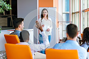 African american Business people Raising there Hand Up at a Conference to answer a question