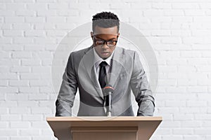 African american business speaker on tribune