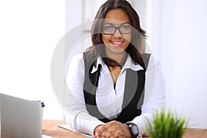 African American business woman is busy with paper job in office