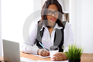 African american business woman is busy with paper job in office