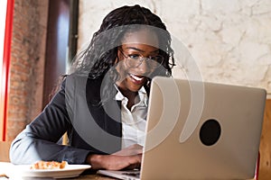 African american business woman in cafe