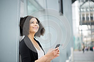 African american business woman smiling with mobile phone