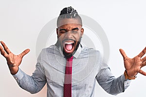 African american businessman with braids wearing tie standing over isolated white background celebrating mad and crazy for success