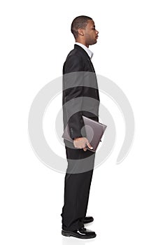 African American businessman carrying notepad