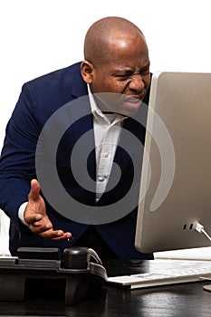 African American Businessman Confused By Computer