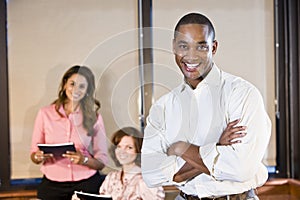 African American businessman with coworkers