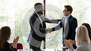 African American businessman handshake male colleague at meeting