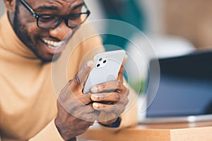 African-American businessman holding Apple iPhone 11 Pro Max