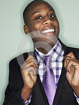 African American Businessman Holding Lapels photo