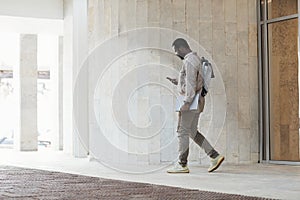 African American Businessman Leaving Office Building