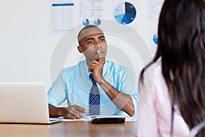 African american businessman listening to employee