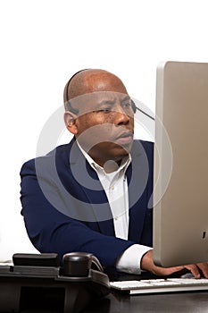 African American Businessman Looks At Computer