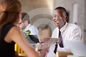 African American Businessman At Meeting With Colleagues