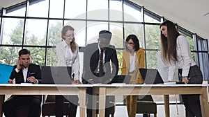 African american businessman presenting business offer for business partners at meeting in conference room, businessman