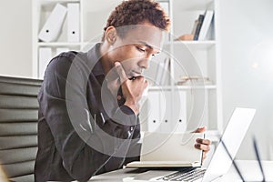 African american businessman reading book