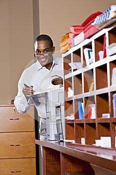 African American businessman reading document