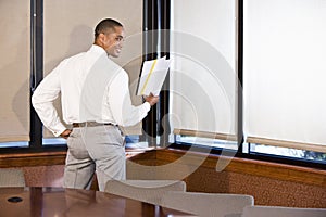 African American businessman reading document