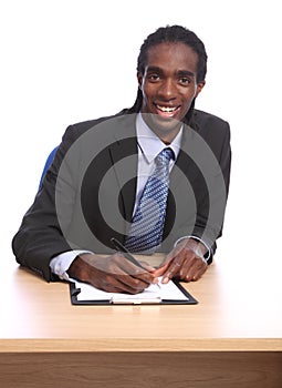 African American businessman signing document photo
