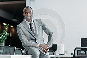 african american businessman sitting on table