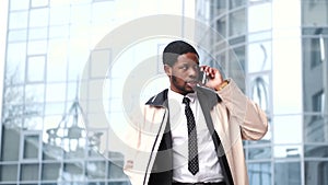 African American businessman talking by cell phone