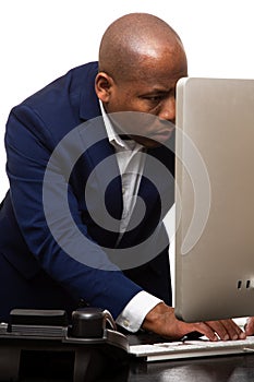 African American Businessman Typing on Computer