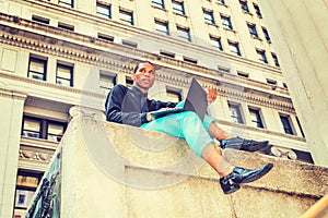 African American businessman working on street in New York