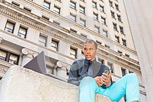 African American businessman working on street in New York