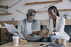 african american businesspeople discussing work during business meeting