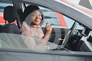 African American businesswoman happy with keys to new car