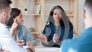 African American businesswoman mentor coach speaking at meeting with staff