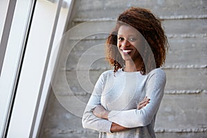 African American Businesswoman Standing Against Office Wall