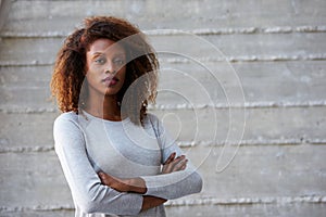 African American Businesswoman Standing Against Office Wall