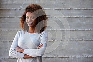 African American Businesswoman Standing Against Office Wall