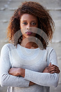 African American Businesswoman Standing Against Office Wall