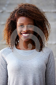 African American Businesswoman Standing Against Office Wall