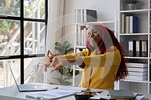 African American businesswoman is tired from working in the office.