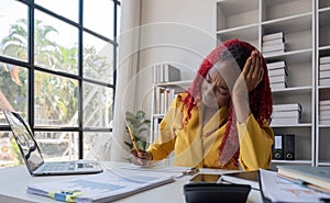 African American businesswoman is tired from working in the office.