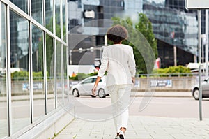 African american businesswoman walking in city