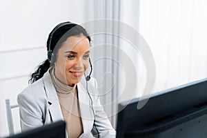African American businesswoman wearing headset working in crucial office