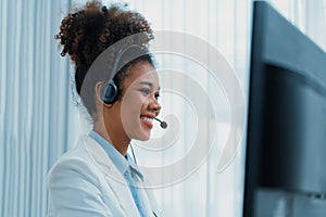 African American businesswoman wearing headset working in crucial office