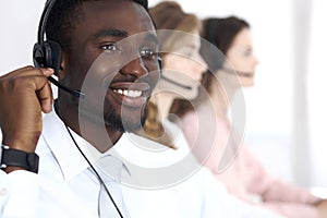 African american call operator in headset. Call center business or customer service concept