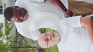African-American caregiver and old man. Professional nurse and patient in a nursing home. Assistance, rehabilitation and